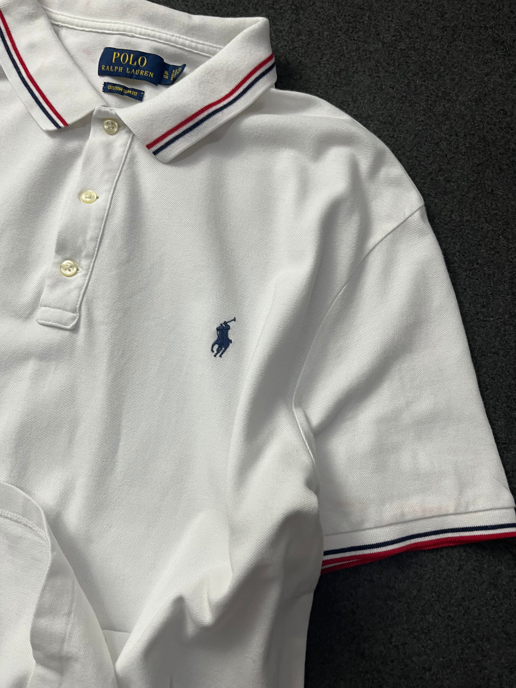 Polo Ralph Lauren classic fit short-sleeved polo shirt with red and navy blue striped tipping on the collar and cuffs