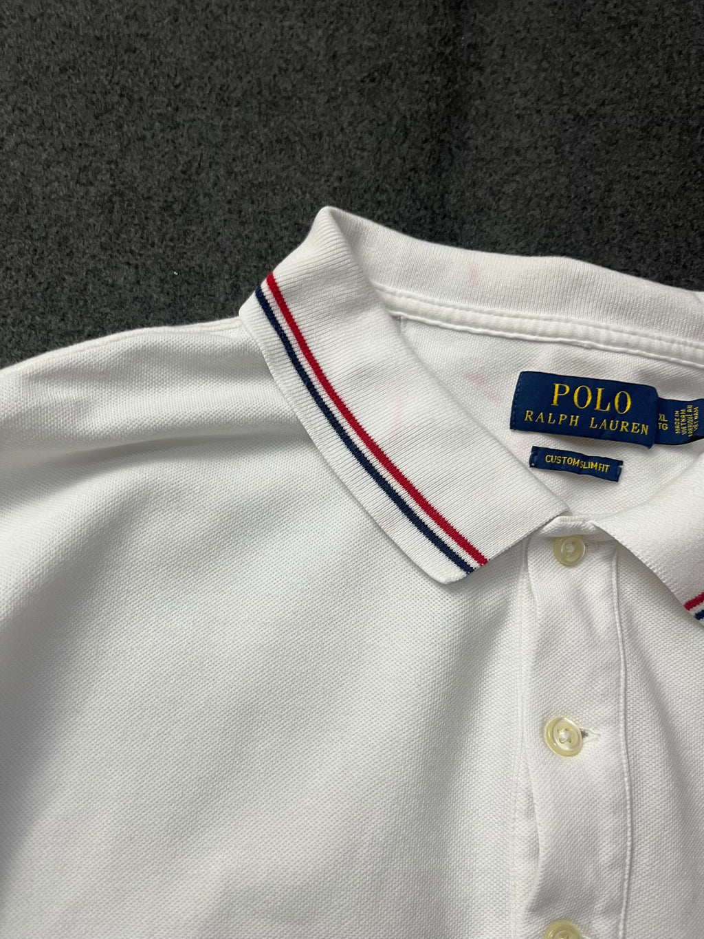 Polo Ralph Lauren classic fit short-sleeved polo shirt with red and navy blue striped tipping on the collar and cuffs