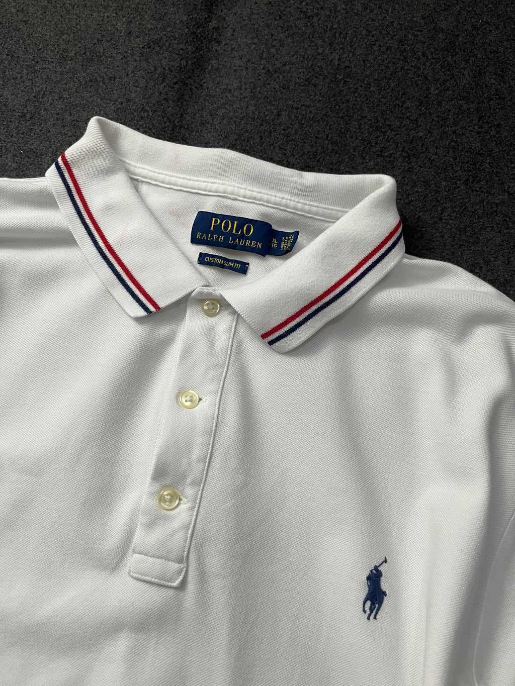 Polo Ralph Lauren classic fit short-sleeved polo shirt with red and navy blue striped tipping on the collar and cuffs