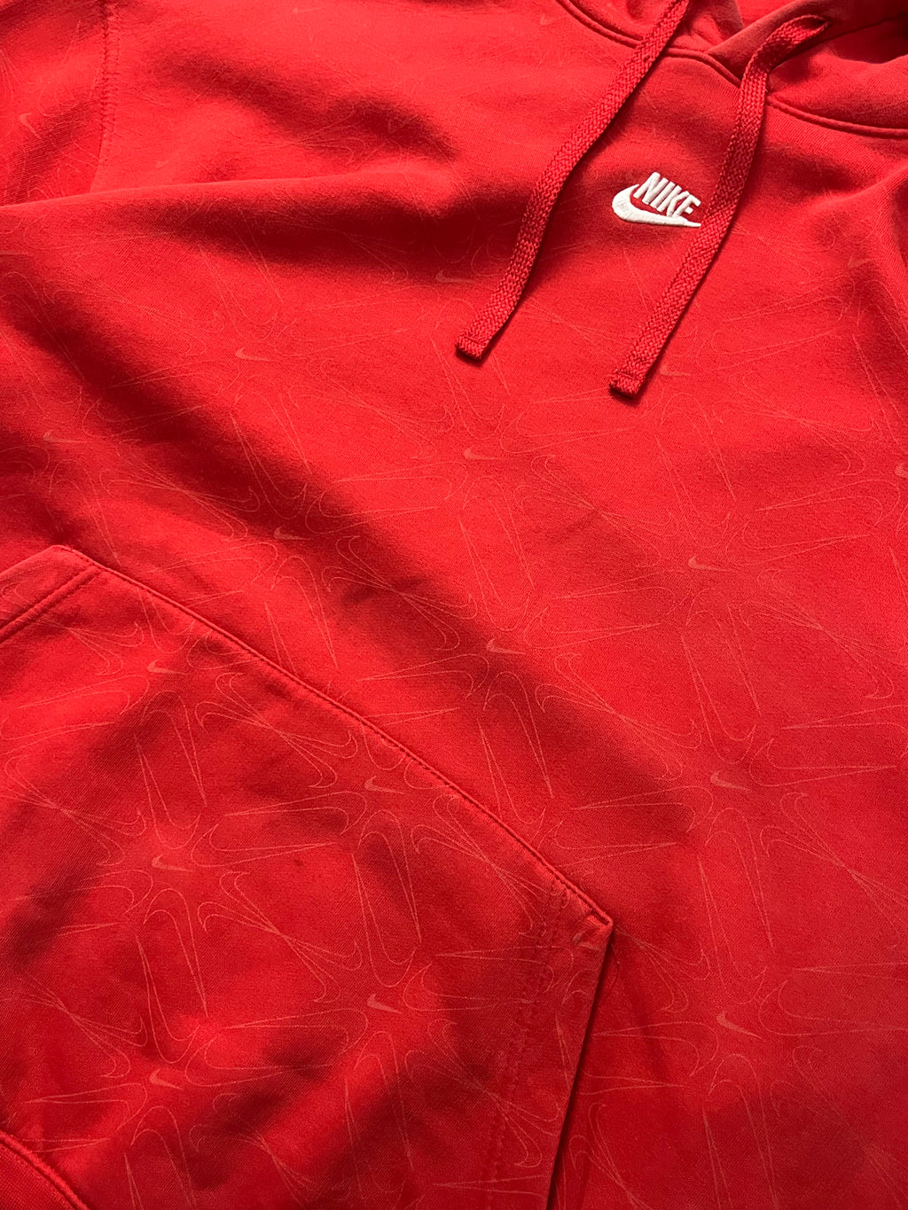 Red nike hoodie with nike all over