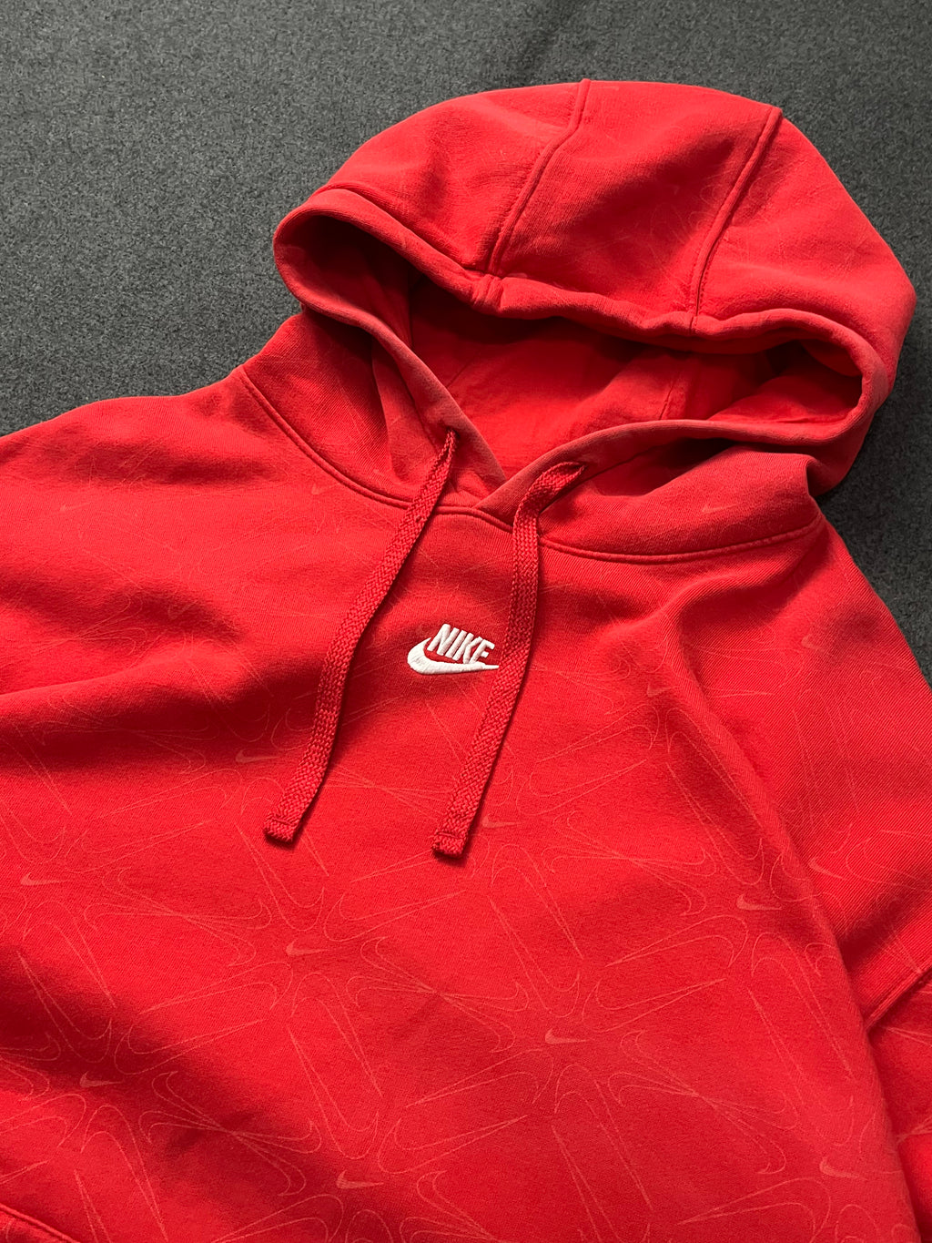 Red nike hoodie with nike all over