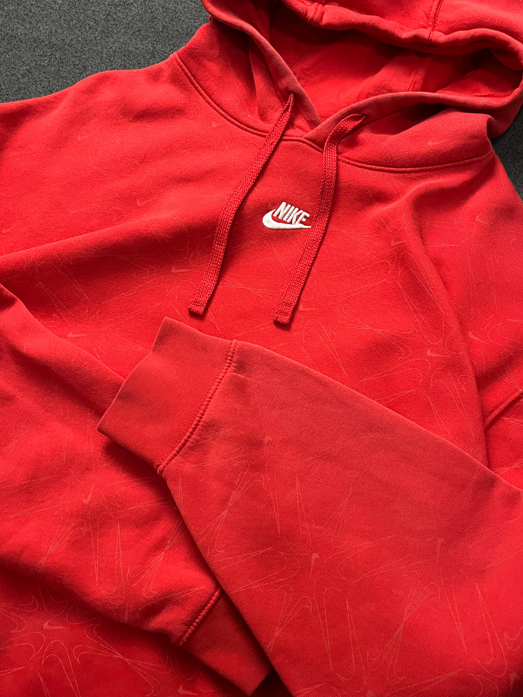 Red nike hoodie with nike all over