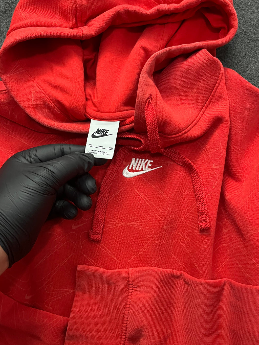 Red nike hoodie with nike all over