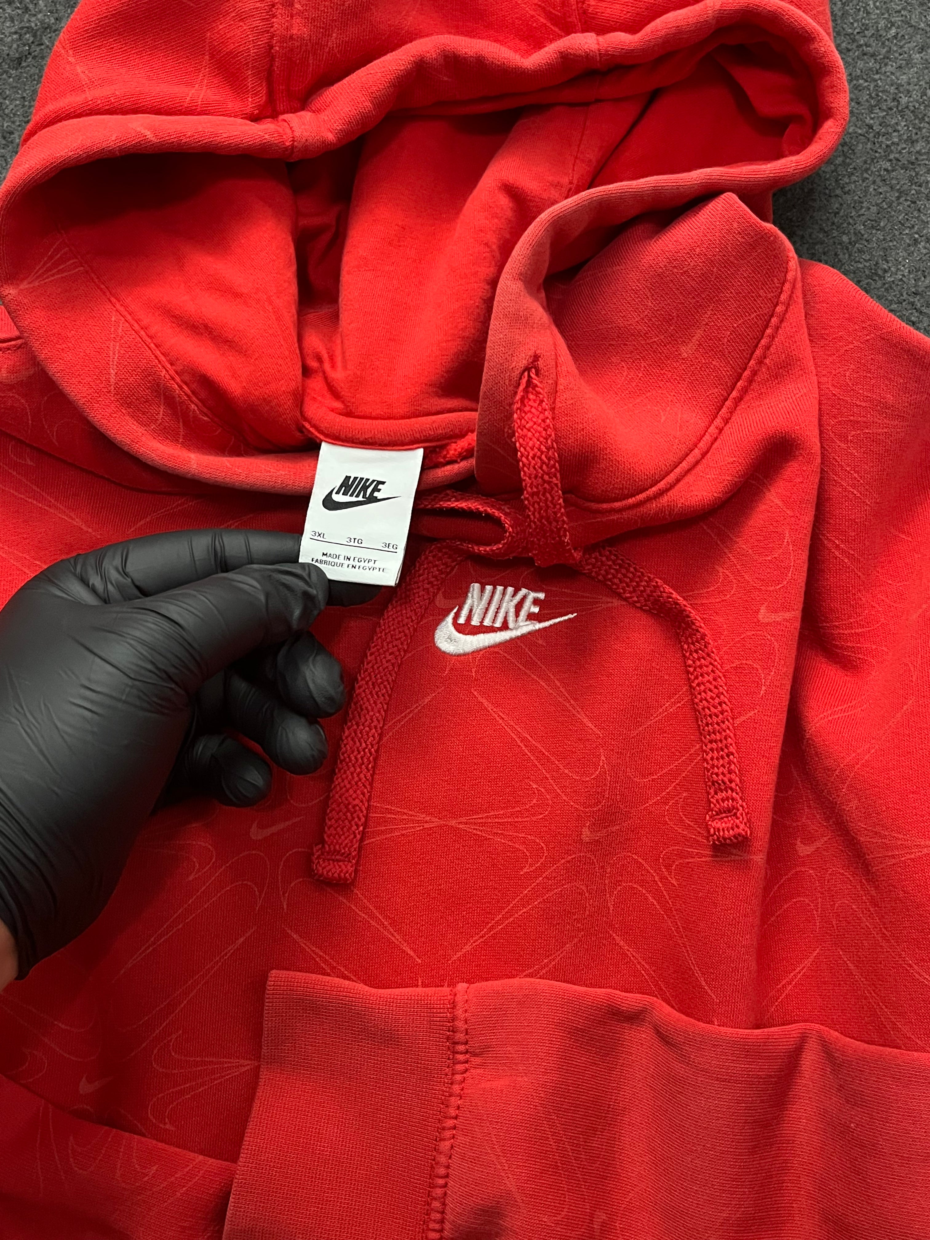 Red nike hoodie with nike all over