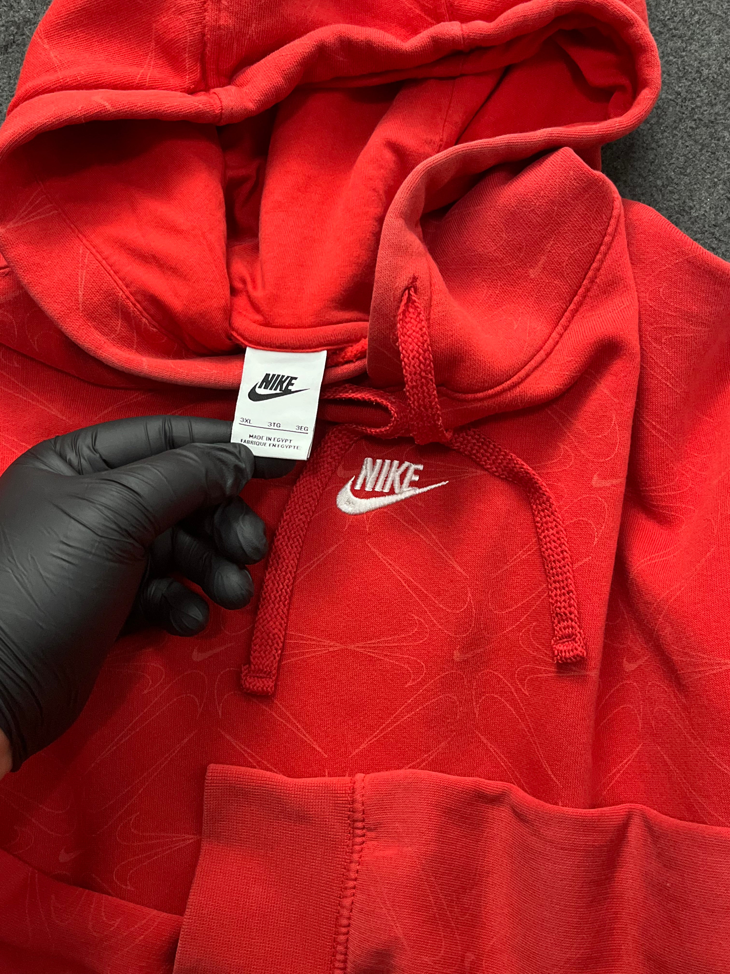 Red nike hoodie with nike all over