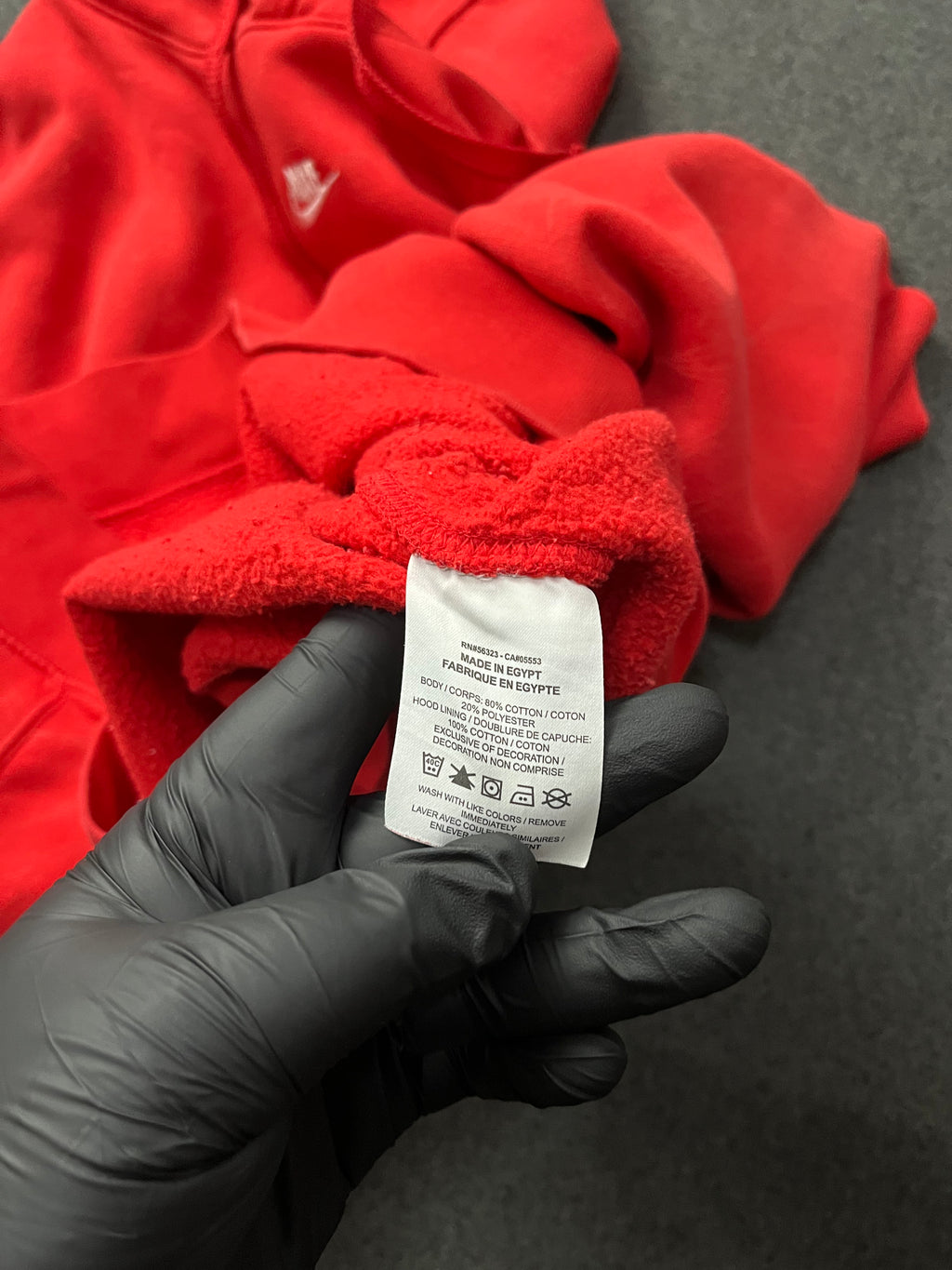 Red nike hoodie with nike all over