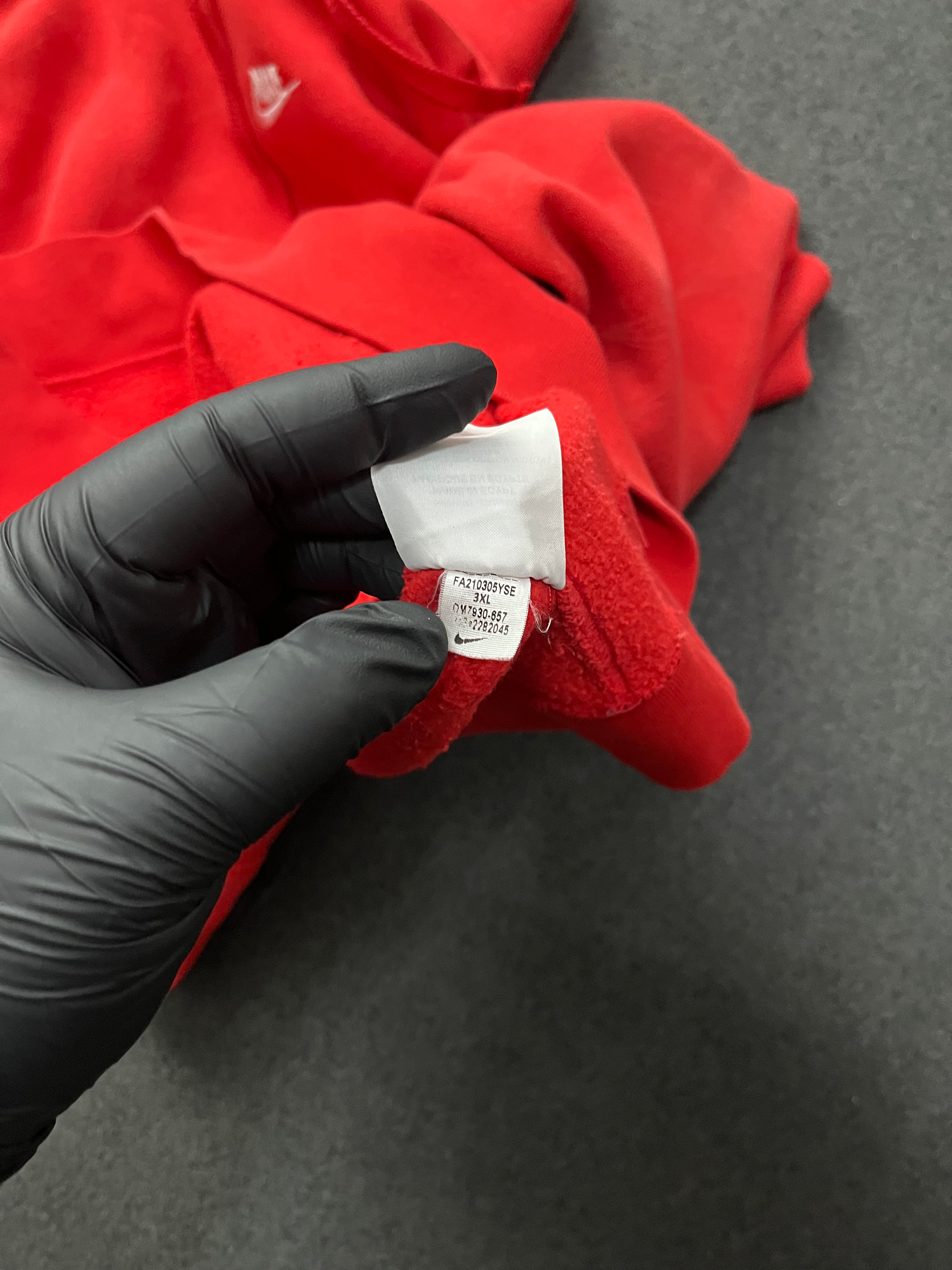 Red nike hoodie with nike all over