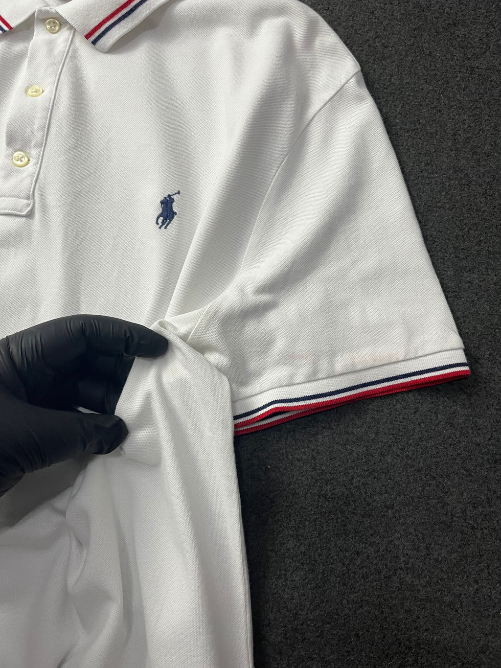 Polo Ralph Lauren classic fit short-sleeved polo shirt with red and navy blue striped tipping on the collar and cuffs