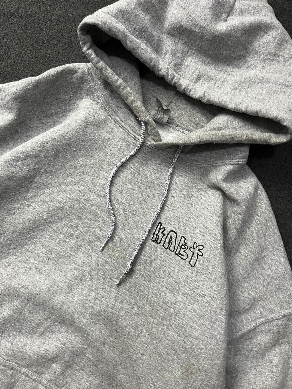 hoodie with a colorful graphic print on the back